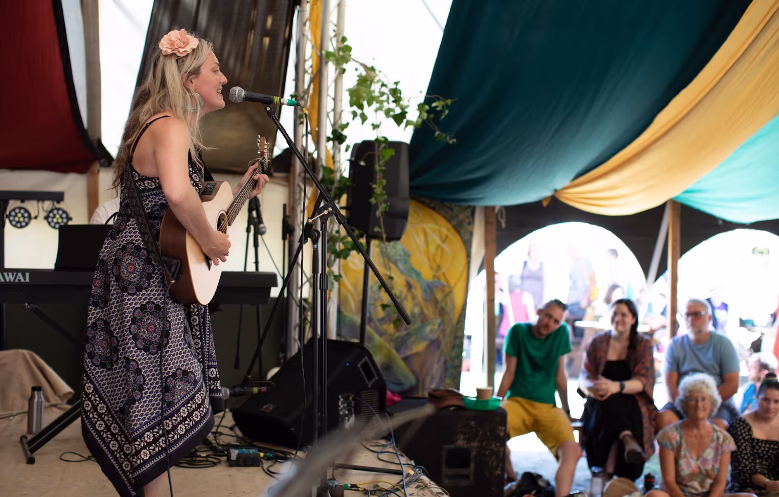 Woman on stage with a guitar