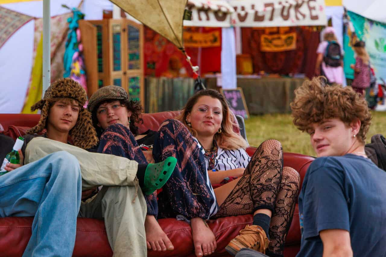 Teens chilling on a sofa